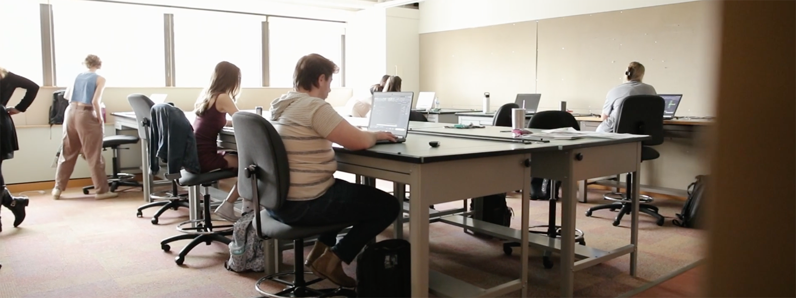 Photo of an interior architecture studio classroom with students working